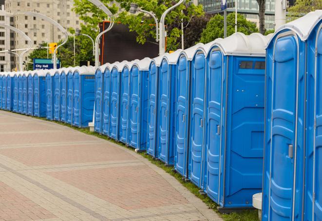 a row of portable restrooms at a fairground, offering visitors a clean and hassle-free experience in Apollo Beach